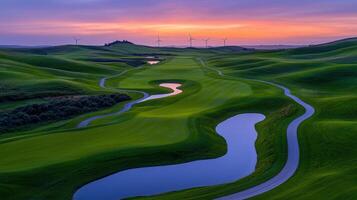 Scenic Golf Course at Sunset with Wind Turbines Rolling Green Hills and Water Features Stunning Landscape photo