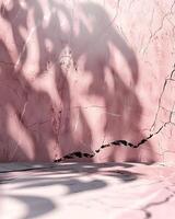A textured pink marble background with shadows creating a soft, artistic ambiance. photo
