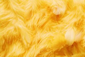 A vibrant yellow fluffy texture adorned with soft feathers for a playful aesthetic. photo
