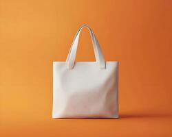 Mock up White Tote Bag on Orange Background photo