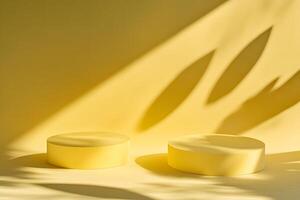 Two Yellow Cylindrical Platforms with Leaf Shadows photo