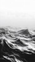 Grayscale Photograph of Ocean Waves under Hazy Sky photo