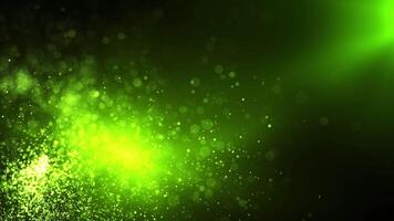 Green abstract background with shiny particles and points of light and dust creating a beautiful bokeh. Seamless looping video