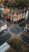 An aerial view of a town with a street crossing photo