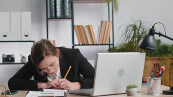 Young businesswoman with anxiety checking time on clock running late to work being in delay deadline video