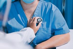 A doctor is checking a patient's heart rate photo