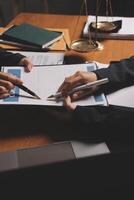 A person is writing on a piece of paper with a pen photo