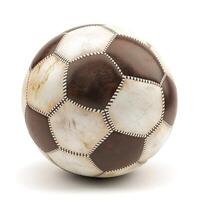 A classic black and white soccer ball resting on a smooth surface, showcasing its textured design and worn appearance. photo