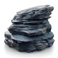 A stack of dark, layered rocks topped with a circular metal object, creating a striking contrast between nature and modernity. photo