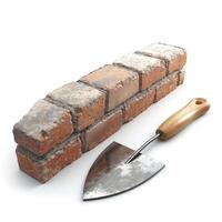 A close-up shot of a weathered brick with a trowel on a white background, showcasing essential tools for masonry work. photo