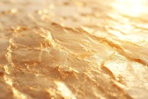 Close-up of shimmering golden texture reflecting light, creating a warm and inviting atmosphere. photo