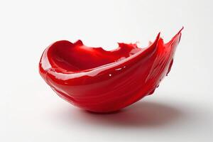 Vibrant red paint splashing elegantly on a white surface, creating an artistic and dynamic visual composition. photo