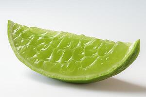 A vibrant green slice of aloe vera showcasing its jelly-like interior. photo