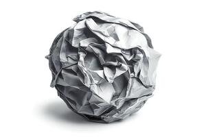 A crumpled paper ball on a clean white background, showcasing texture and form. photo