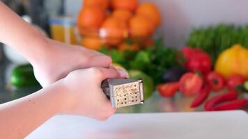 Hand Squeezing Out Minced, Crushed, Garlic Using A Small Garlic Pressing Tool. video