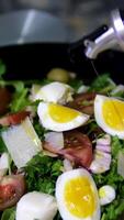 add olive oil to salad Rotating salad bowl with Salad of fresh vegetables and tuna, tomatoes and eggs. Diet salad of healthy food video