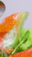 rolls with red caviar Spring rolls Pancakes or rolls with caviar and butter. Close up video