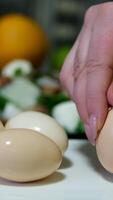 eggshell Hands skillfully peel the shells off freshly boiled eggs, revealing the smooth white surface. Eggshells scatter on the countertop, conveying a sense of culinary preparation and simplicity. video