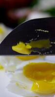 Sliced egg slices fall on a glass surface. video