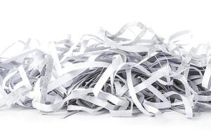 A pile of white and gray shredded paper, creating an abstract texture effect. photo