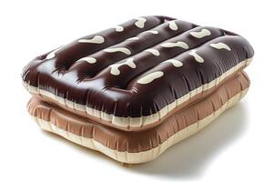 Two inflatable air mattresses resembling ice cream sandwiches stacked together. photo