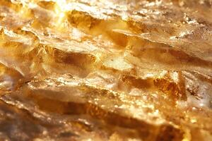 Glittering golden waves of textured material reflecting light beautifully. photo