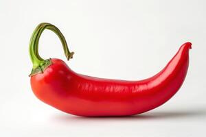 A vibrant red chili pepper showcasing its glossy skin and curved shape against a clean, neutral background. photo