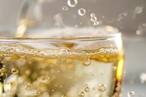 A close-up view of a sparkling beverage in a glass, with bubbles rising to the surface, capturing a sense of freshness. photo