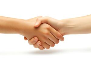 A close-up of two hands, one light and one dark, engaged in a handshake symbolizing unity and partnership. photo