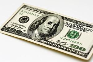 Close-up of a crisp one hundred dollar bill on a white background. photo