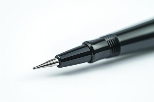 Close-up of a sleek black pen highlighting its fine point and glossy finish. photo
