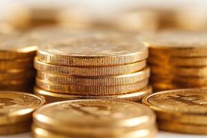 A close-up view of stacked golden coins, symbolizing wealth and investment. photo