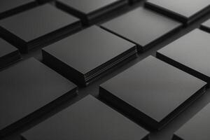 A monochromatic layout of stacked black business cards showcasing a sophisticated and modern aesthetic. photo