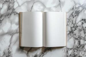 An open blank book lays on a stylish marble surface, inviting creativity and inspiration. photo