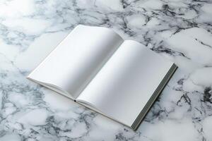 An open blank book rests on a marble countertop, inviting creativity and ideas. photo