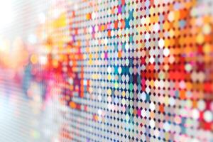 Colorful abstract pattern with vibrant dots reflecting light. photo