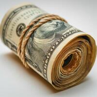 A close-up of a rolled bundle of cash secured with twine, showcasing details of the banknotes. photo