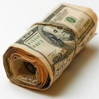 A rolled bundle of hundred dollar bills, symbolizing wealth and finance. photo
