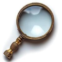 Antique golden magnifying glass isolated on a white background, showcasing intricate details around the handle. photo