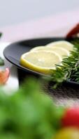 cut a cucumberClose up to the Lobster Pad Thai is ready to serve with fried noodle, tofu and other ingredients on a rectangular plate in studio light. video