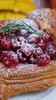 cherry cake with powdered sugar Freshly baked beautiful puff pastries with apples are sprinkled with powdered sugar on a wooden table. Dessert with apples. Homemade fragrant pastries. video