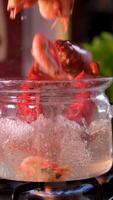 throw shrimp into boiling water Lobster being taken out of boiling pot in slow motion. Shot with Phantom Flex 4K camera. video