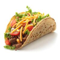 A vibrant taco filled with seasoned beef, fresh lettuce, tomatoes, and shredded cheese. photo