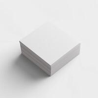 A stack of blank white business cards viewed from above, creating a minimal and clean look. photo