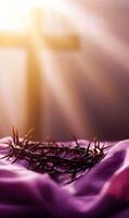 Crown of Thorns and Blurred Cross Symbolizing Jesus Christ's Sacrifice and Redemption photo