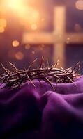 Crown of thorns with cross in background for lenten season and holy week concept photo