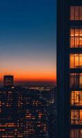 Panoramic View of New York City Skyline at Sunset with Illuminated Buildings and Gradient Sky photo