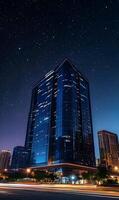 Cityscape at night with a modern building illuminated under a starlit sky serene urban view photo