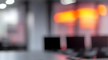 Abstract computer lab scene featuring rows of monitors and keyboards in a blurred, glowing effect photo