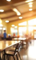 Blurred Interior of a University Cafeteria with Long Tables and Chairs During Lunchtime. photo